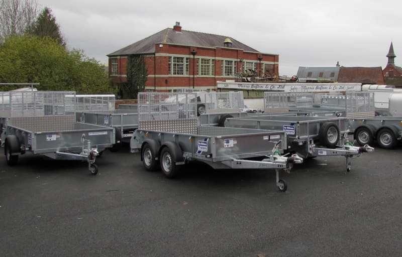Enclosed cargo trailer parked on a suburban street with a closed rear door and side marker lights